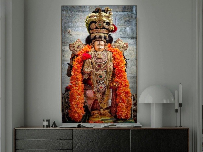 lord venkateswara orange garlands canvas wall art shown framed in a real room, view 0